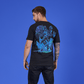 Man wearing a black t-shirt with a blue graphic design on the back against a blue background