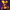 Person wearing an orange cap with a pumpkin design and mouse ears against a purple background