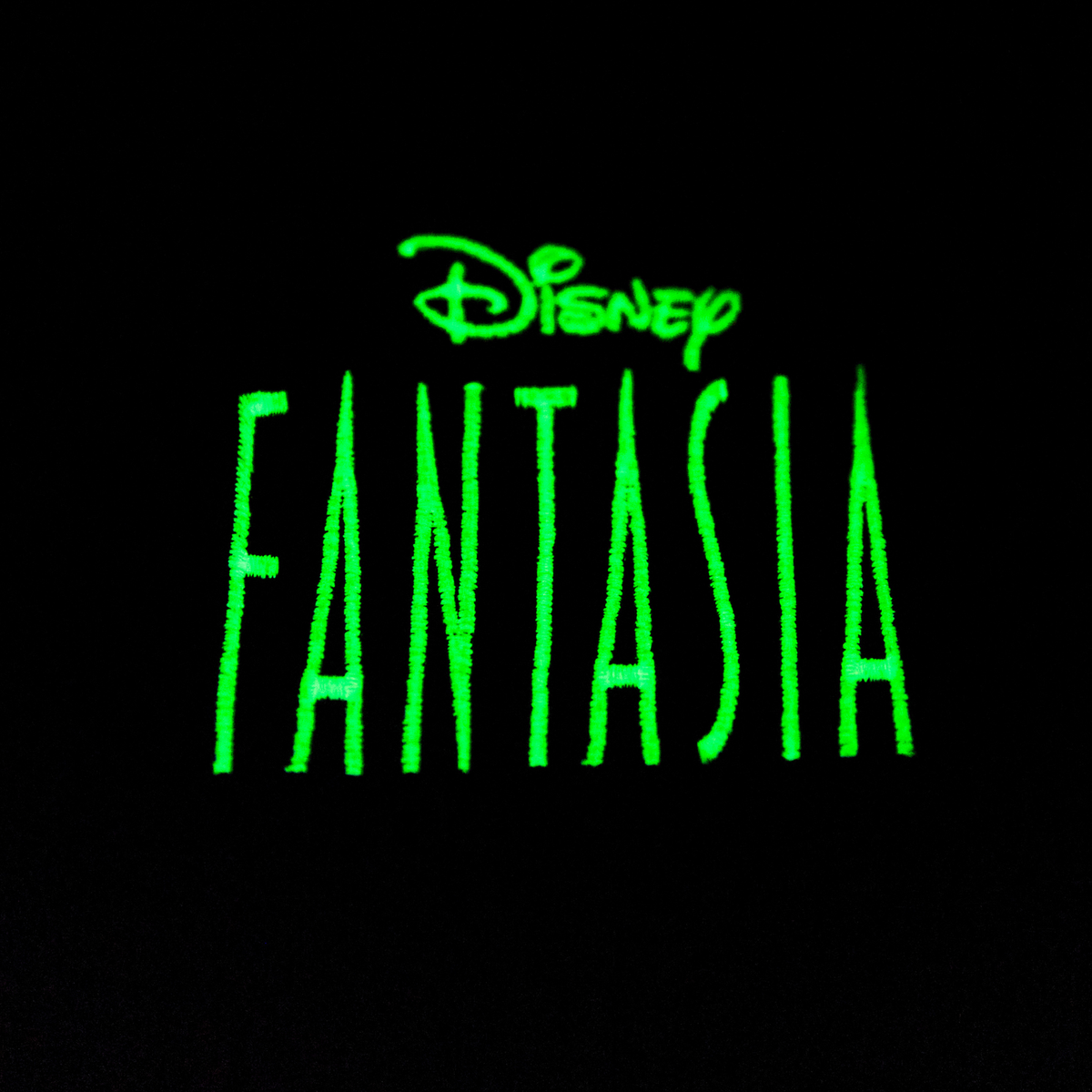 Green 'Fantasia' text with Disney logo on a black background