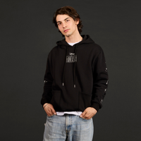 Person wearing a black hoodie with 'Fantasia' text on a dark background
