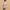 Person holding a pink Cakeworthy Harry Potter Birthday Duffle Bag against a beige background