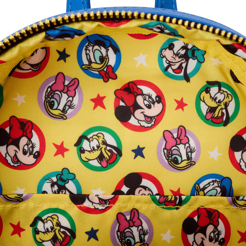 Mini backpack featuring a collage of Mickey Mouse prints from Disney’s early years

