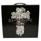 Black box with decorative skull and crossbones design on a white background
