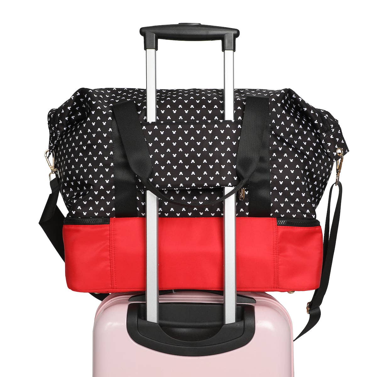 Black and red patterned travel bag with wheels on a white background