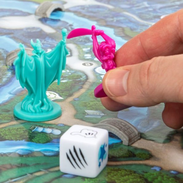 Hand holding a pink game piece over a green board game with a die