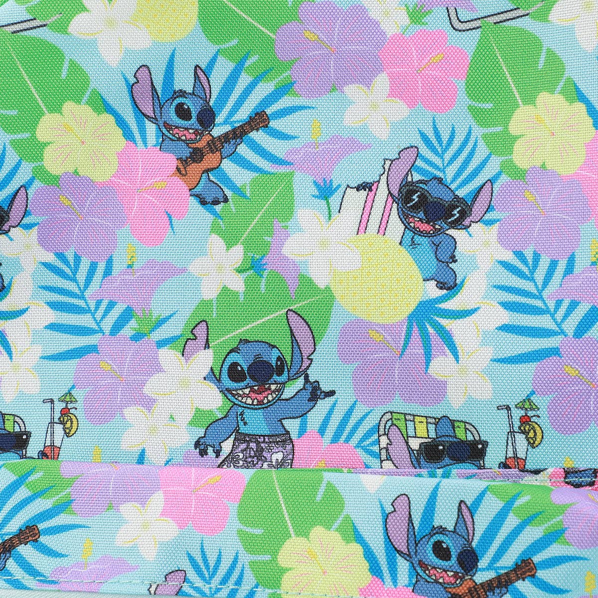 Fabric with cartoon character surrounded by flowers and leaves on a colorful background