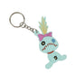 Keychain with a cartoon character wearing a pink bow on a white background
