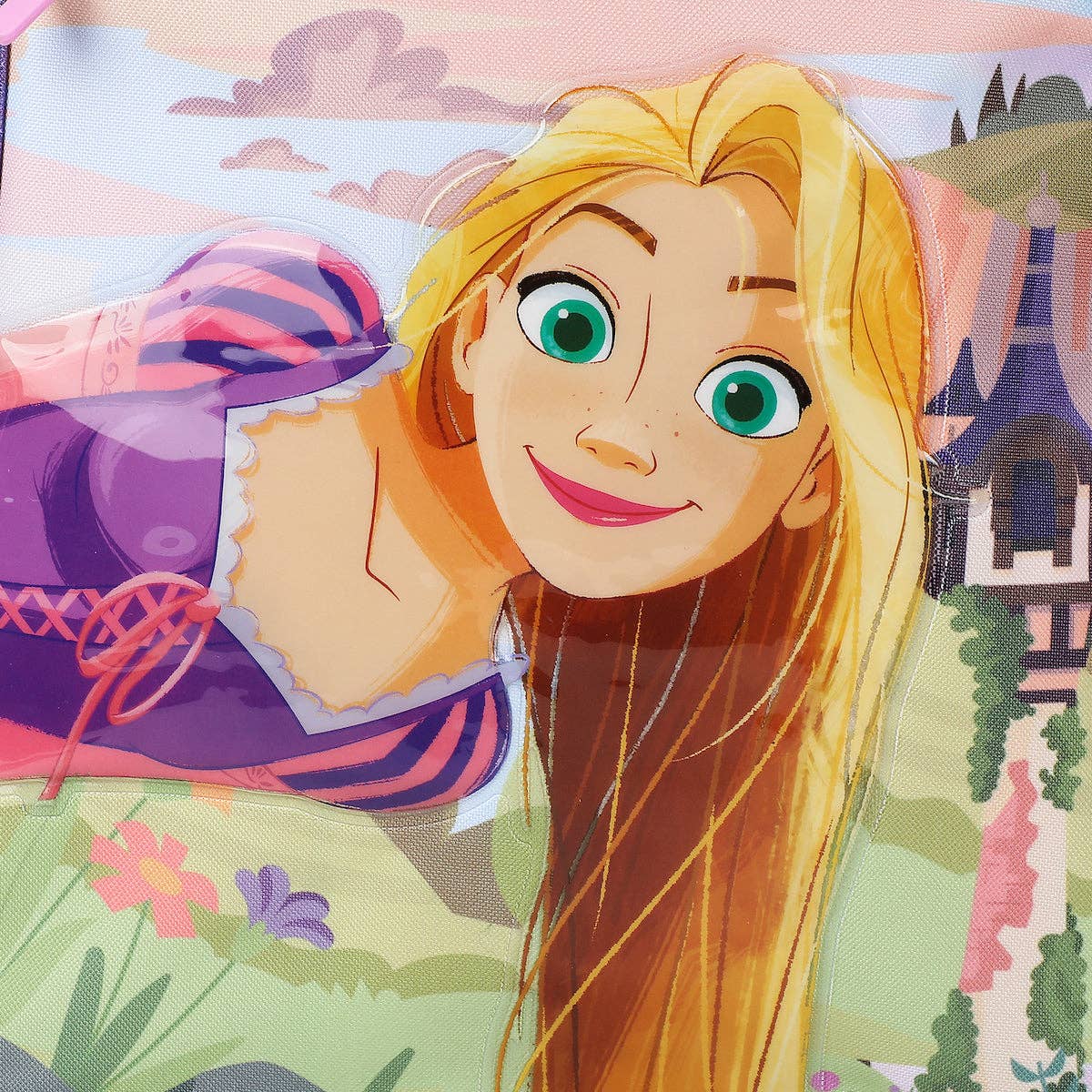 Cartoon character with long blonde hair and green eyes, wearing a purple outfit with pink accents, against a colorful background.