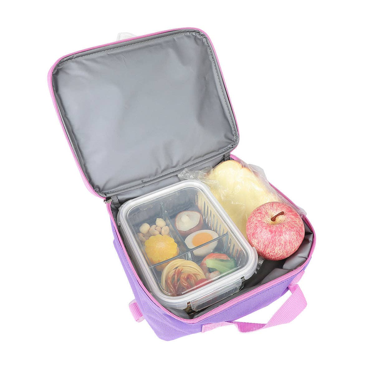 Purple lunch bag with a compartment containing fruits and a pink apple on a white background