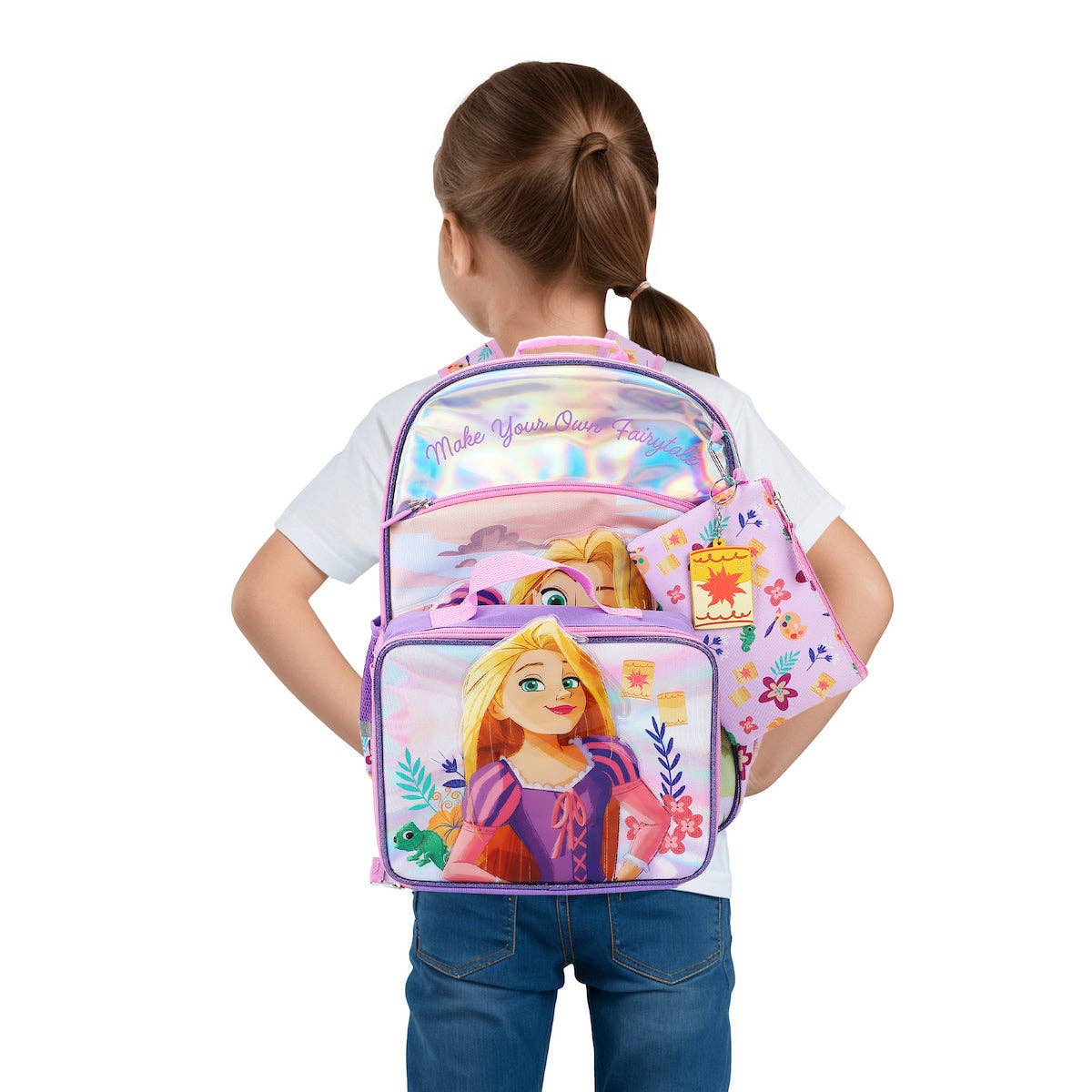 Child wearing a Disney Princess backpack with Rapunzel design on a white background