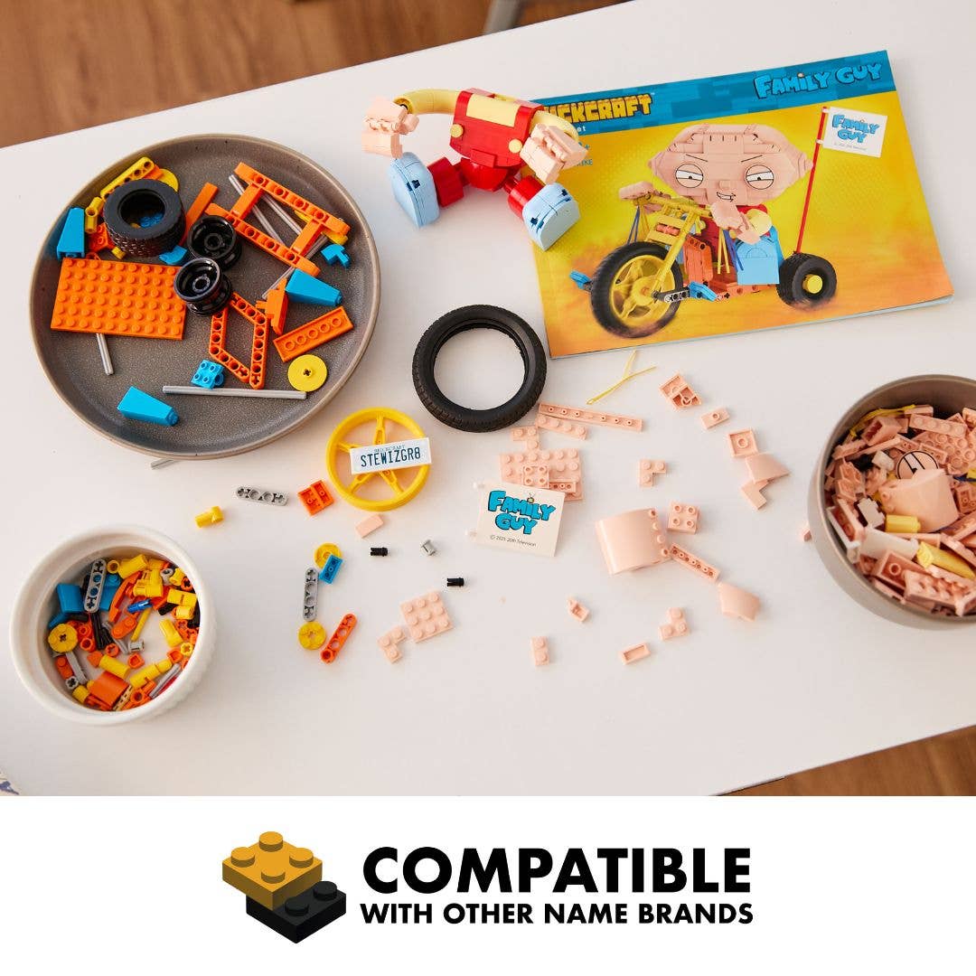 Children's toys including building blocks and figurines on a table with a Minecraft-themed box.