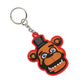 Keychain with a cartoon bear face design wearing a top hat on a white background