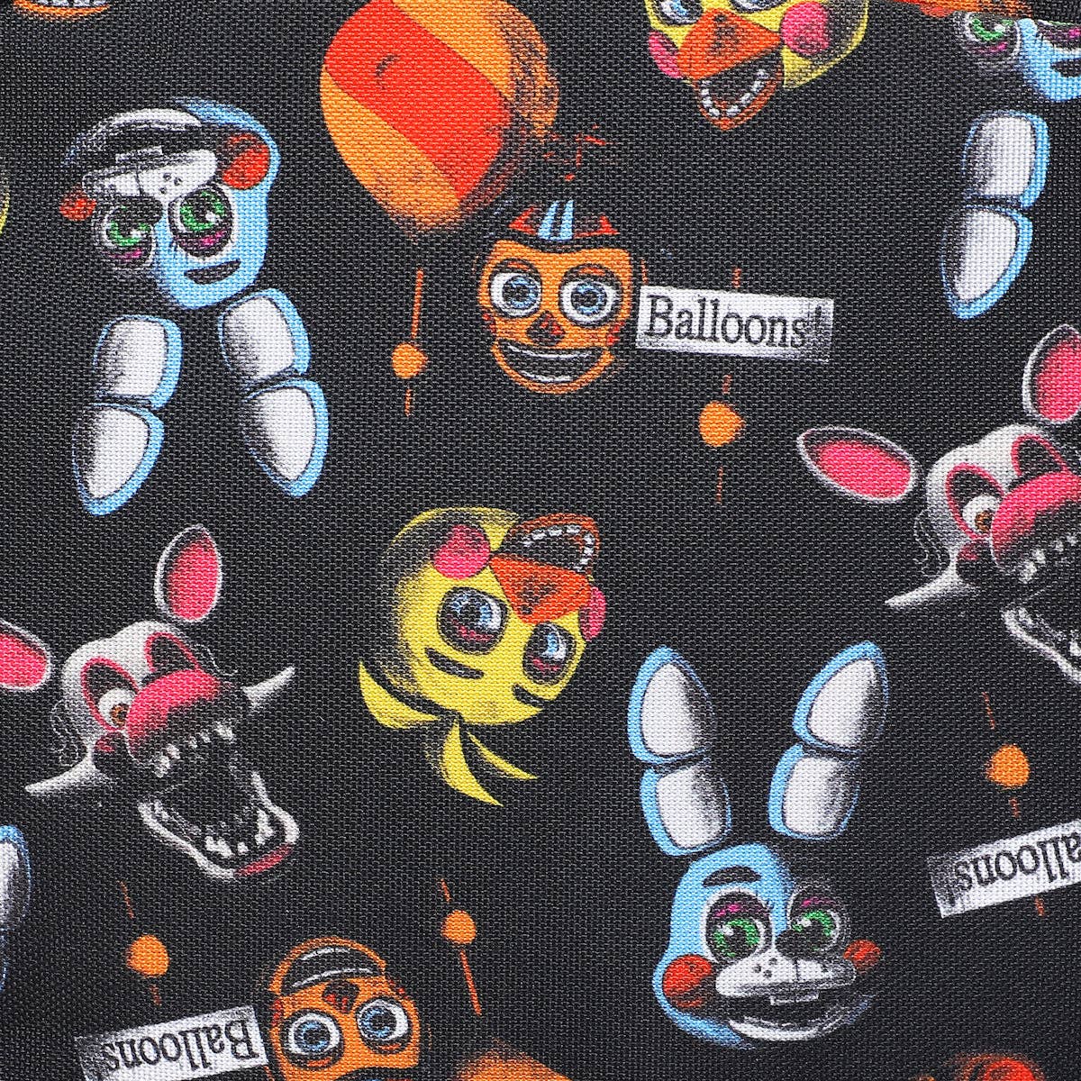 Patterned fabric with cartoon character faces and 'Balloons' labels on a black background