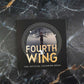 Fourth Wing coloring book on a marble surface