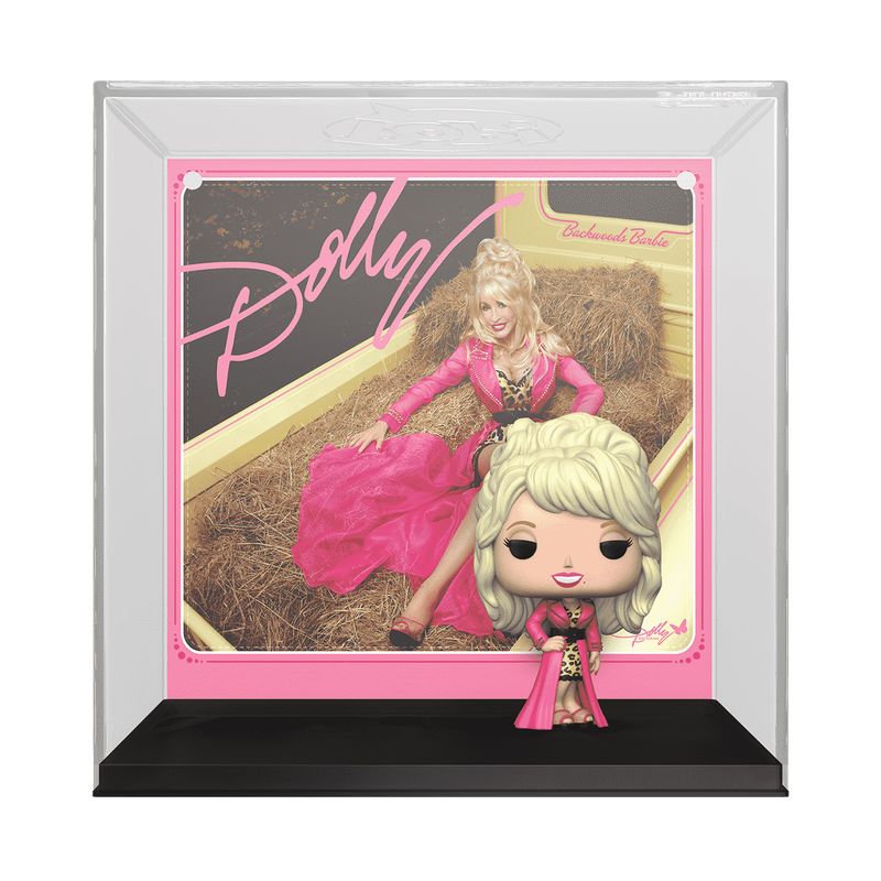 Framed collectible figure of a doll in a pink dress with 'Dolly' branding.