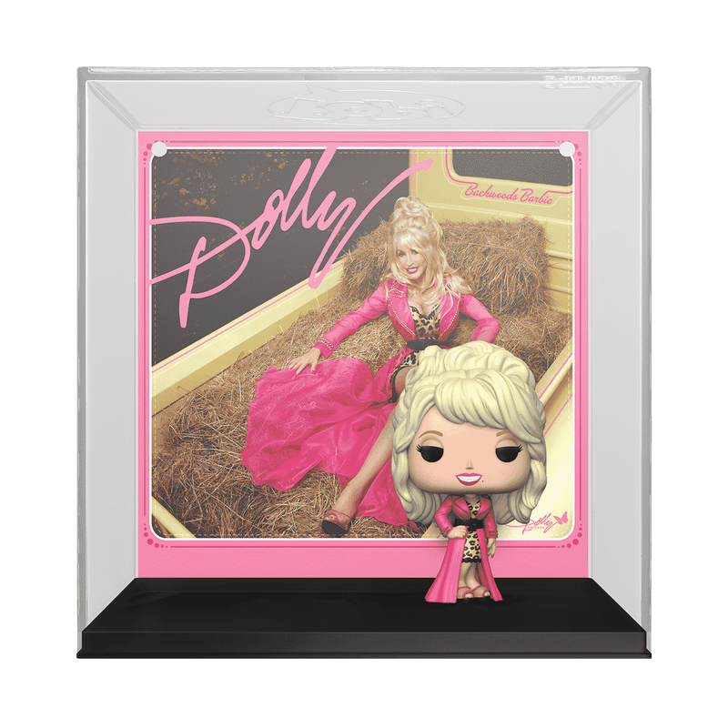 Framed collectible figure of a doll in a pink dress with 'Dolly' branding.