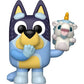 Blue and yellow cartoon character holding a small white creature with a yellow horn on a white background