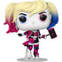 Funko Pop! vinyl figure of Harley Quinn on a clear plastic display stand, featuring blonde and blue pigtails with pink gradients, a pink and black diamond-patterned outfit, and holding a pink and black mallet.