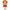 Toy figure of a character with red hair, blue eyes, and a red dress on a white background