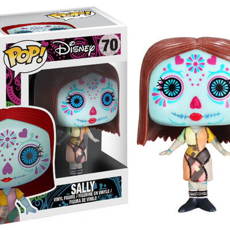 Disney Funko Pop! vinyl figure of Sally from The Nightmare Before Christmas, shown next to its original window box packaging. The figure features a light blue face with colorful sugar skull makeup, red hair, and a patchwork dress.