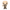 A stylized vinyl figure of a bald man with a gray beard, wearing a beige trench coat over a brown suit, holding a small yellow object with a flame, shown on a plain white background.