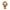 A stylized vinyl figure of a character with a gray skull-like face, brown hair, orange and yellow flame effects around the head and body, and red tear-like details, shown on a plain white background.