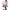 Figurine with a white face, red markings, and black top hat on a white background
