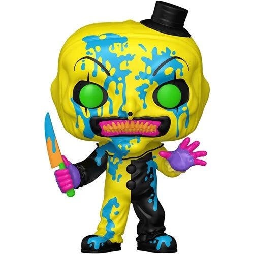 Colorful toy figure with a yellow head and black top hat, holding a knife on a white background.