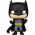 Batman figurine with black cape and yellow belt on a white background