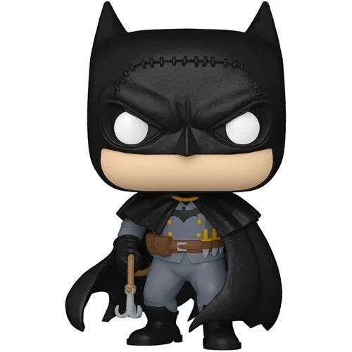 Batman figurine with cape and mask on a white background