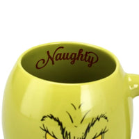 Green mug with 'Naughty' inside on a white background