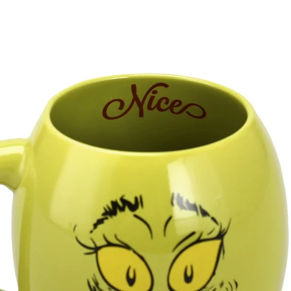 Green mug with cartoon face and 'Nice' text on a white background
