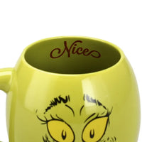 Green mug with cartoon face and 'Nice' text on a white background