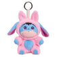 A pink and blue plush character keychain with long floppy ears, a metal key ring, and a cream strap, shown on a plain white background.