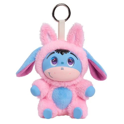 A pink and blue plush character keychain with long floppy ears, a metal key ring, and a cream strap, shown on a plain white background.
