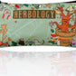 Pencil case with 'Herbology' design featuring a dragon and plants on a green background.