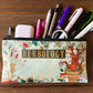 Pencil case with 'Herbology' design on a wooden surface