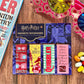 Set of Harry Potter magnetic bookmarks on a wooden surface with jelly beans.