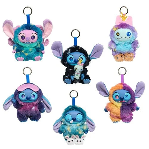 Set of colorful plush keychains on a white background