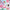 Cartoon characters with colorful backgrounds and pink logos on a product surface.