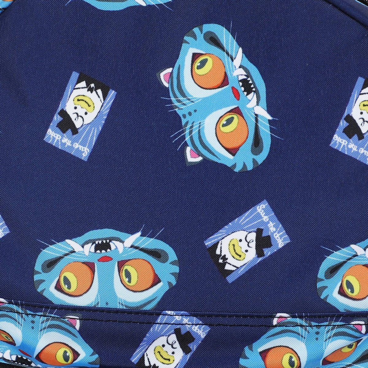 A close-up of a navy blue fabric featuring a repeating pattern of cartoon blue tiger faces with large orange eyes and small rectangular character prints.
