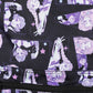 Patterned fabric with cartoon characters and stars on a black background