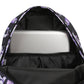 Backpack with purple floral pattern inside, containing a white laptop.