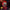 Mega scale collectible figure of the Killer Clown from Outer Space by Mezco Toyz, featuring detailed red hair, a creepy clown mask with a red nose and smile, and a striped purple and orange costume.