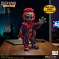 Colorful clown figure with red hair and a striped suit on a wooden table, with 'Killer Klowns from Outer Space' branding.