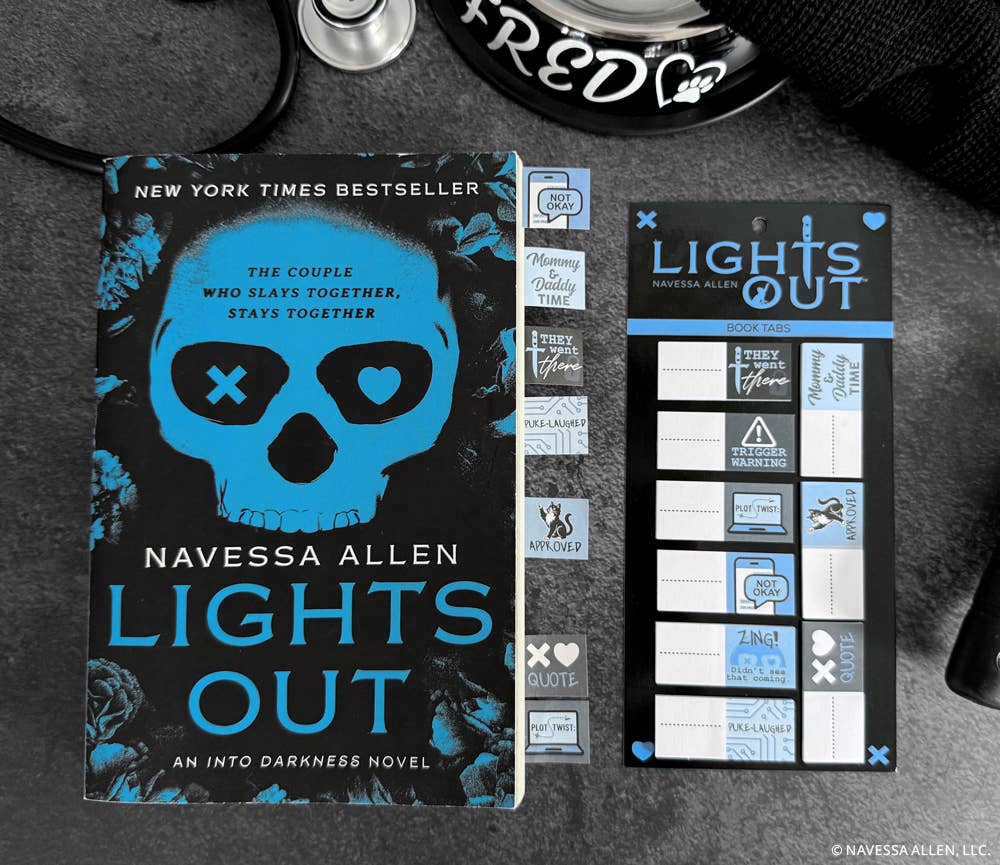 Book titled 'Lights Out' by Navessa Allen with a blue skull design on a dark background.