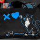 Black bag with a cat design and 'Fred Approved' text on a table.