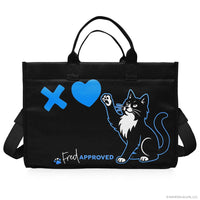 Black tote bag with a cat design, blue heart, and 'Fred Approved' text on a white background