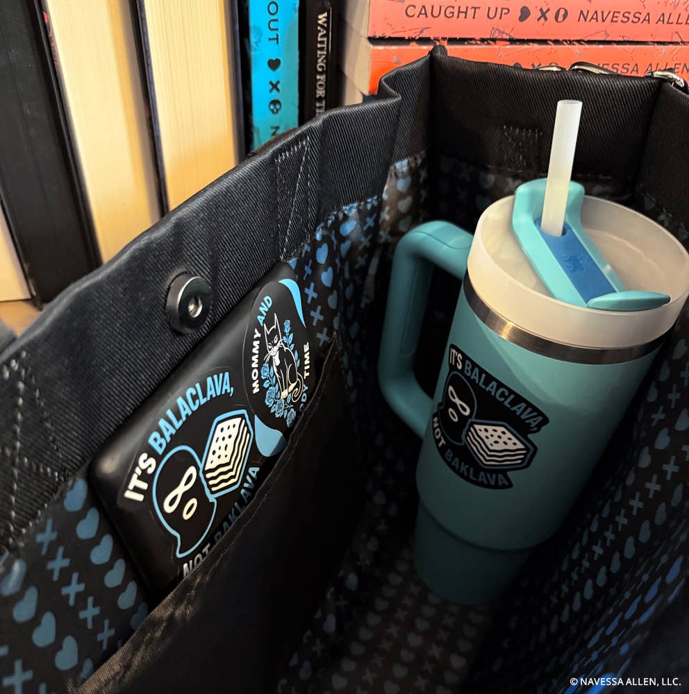Blue tumbler with straw in a bag, featuring Balacлавa branding.