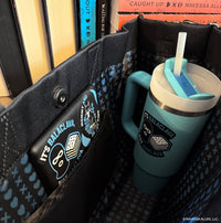 Blue tumbler with straw in a bag, featuring Balacлавa branding.